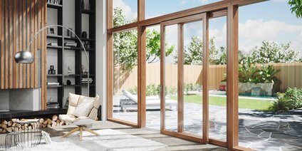 Espace de vie moderne avec grand vantail soulevant-coulissant en bois et vue sur le jardin