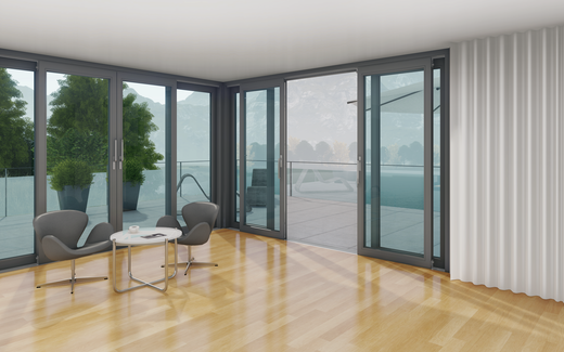 Espace de vie moderne avec des éléments coulissants à levage de grande surface et vue panoramique